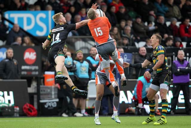 Howard Packman competing for the ball