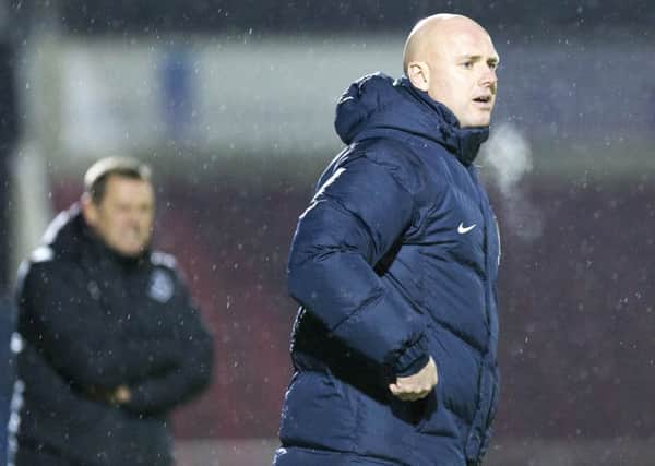 Cobblers boss Rob Page watches his Cobblers team draw 1-1 with West Ham United Under-21s, before seeing them lose 3-2 in a penalty shootout (Pictures: Kirsty Edmonds)