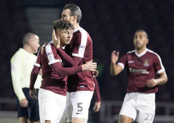 FIRST BLOOD - Harry Beautyman is congratulated by Zander Diamonds after firing the Cobblers ahead agains West Ham United Under-21s (Pictures: Kirsty Edmonds)