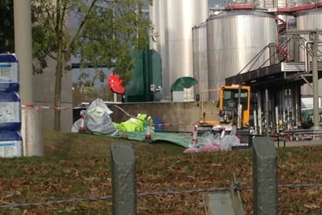 An area in the forecourt at Carlsberg is cordoned off with cones.