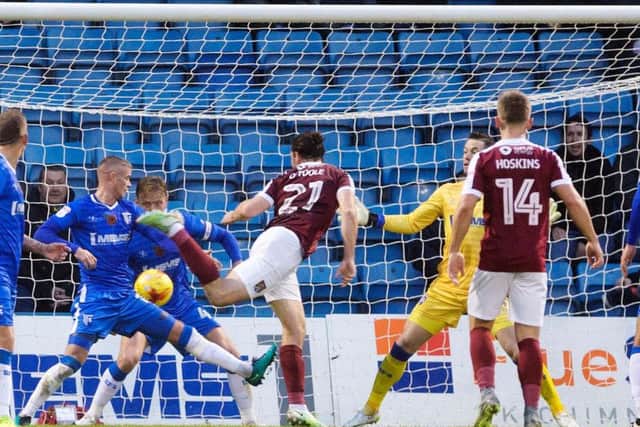 HIT THE FRONT: John-Joe O'Toole heads Northampton into the lead at the Priestfield Stadium on Saturday. Pictures: Kirsty Edmonds