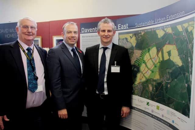 Daventry MP Chris Heaton-Harris, centre, is shown around the exhibition