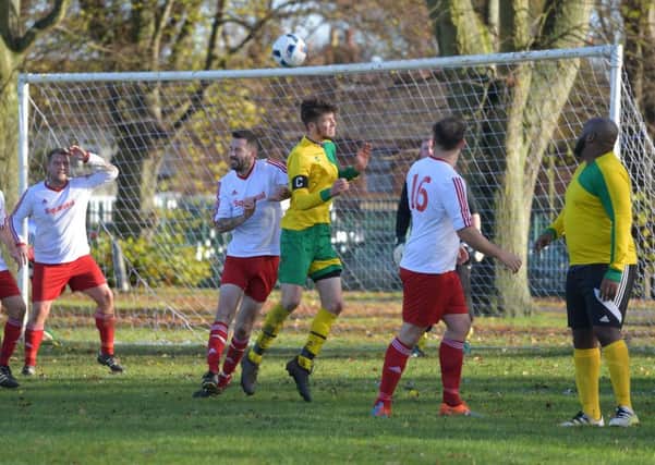 HEADS UP - action from Dallington Falcons' win over Squizzas (Pictures: Dave Ikin)