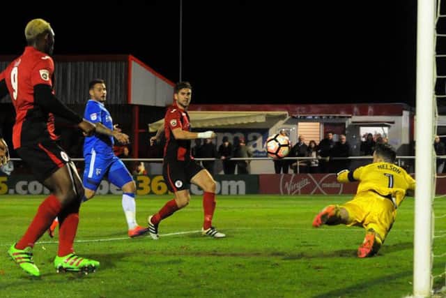 James Armson fires home his second goal past Gillingham keeper Stuart Nelson (picture: Jake McNulty)