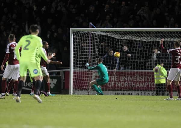 SICKENER - Adam Smith watches as Chris Forrester's glancing header hits the net to give Peterborough a 1-0 derby win (Pictures: Sharon Lucey)