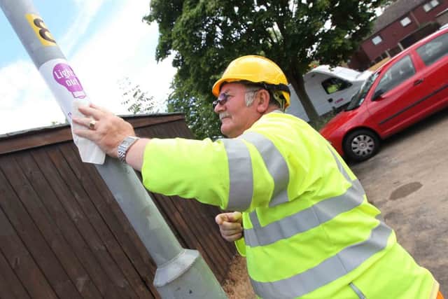 Roger Hayman, street lighting operative, starts the switch-off in 2011