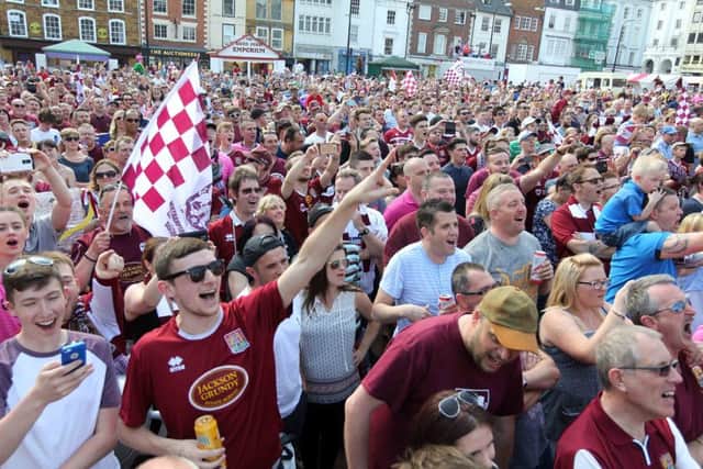 Northampton Town Football Club open top bus victory parade in Market Square. NNL-160905-132554009