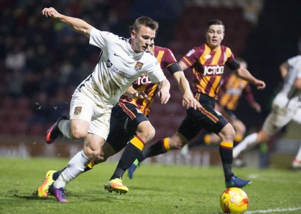 ON THE ATTACK - Sam Hoskins takes on his man against Bradford City at Valley Parade (Pictures: Kirsty Edmonds)