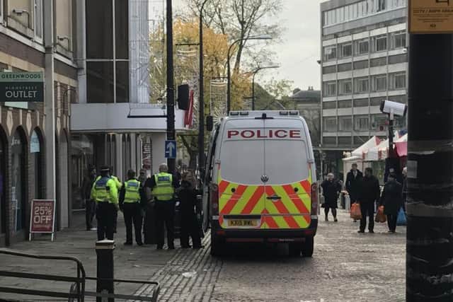 Police dealing with the incident in Market Square, Northampton