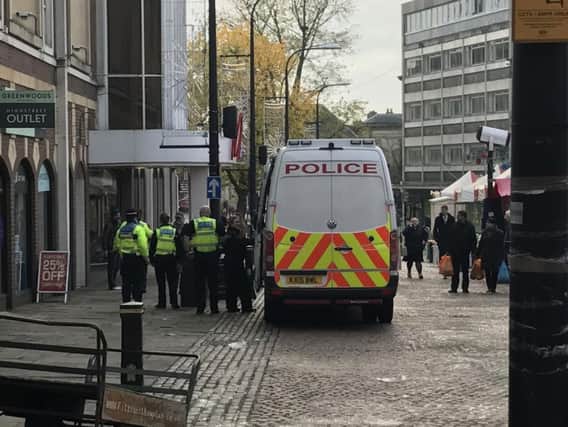 Police dealing with the incident in Market Square, Northampton