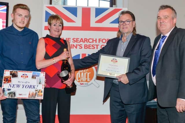 SIG Roofing's managing director Andrew Wakelin presents the Britain's Best Cafe national winner award to the Super Sausage team. Left to right, Simon, Gail and Chris Murray and Andrew Wakelin