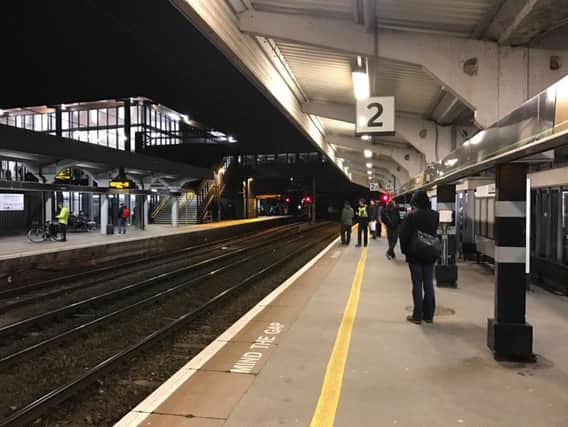 Photo taken from Northampton station yesterday shows a policeman watching on from the platform.