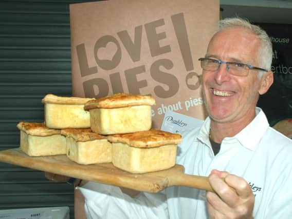 Mark Hoogenboom shows off some of his delicious Dunkleys pies at a festival earlier this year