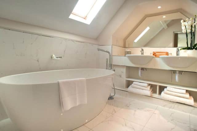 Standalone baths in some of the rooms add a touch of luxury