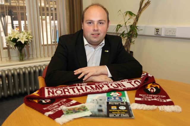 Councillor David Mackintosh with his Cobblers programme, ticket and scarf from 1997.