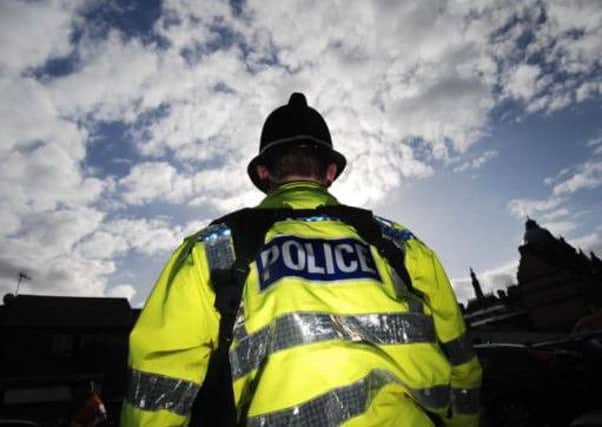 Police are appealing for witnesses to a burglary in Duston, where the victim woke up to find two intruders in her house.