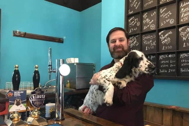 Terry Steers of the St Giles Ale House with pub dog, Stella