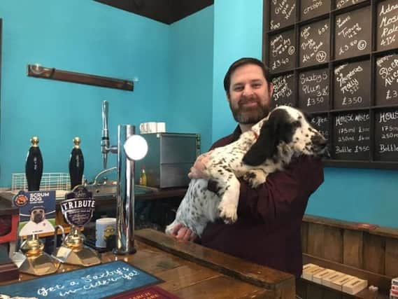 Terry Steers of the St Giles Ale House with pub dog, Stella