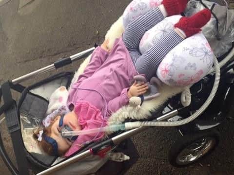 Melina using the special pushchair bought by Newlife Foundation for Disabled Children