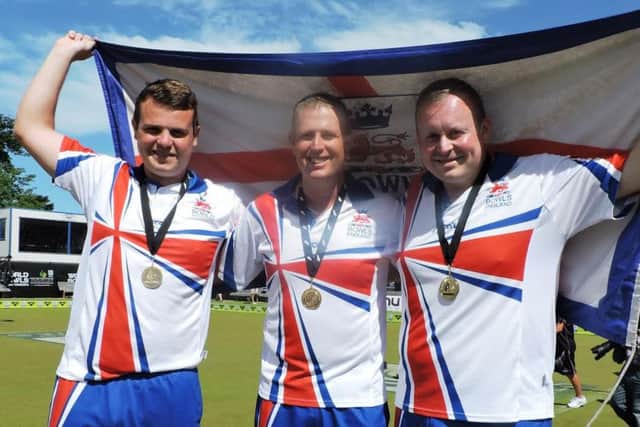 WORLD CHAMPIONS! - Northamptons Jamie Walker (left) with his team-mates Robert Paxton and Andrew Knapper after their gold medal success