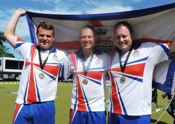 WORLD CHAMPIONS! - Northamptons Jamie Walker (left) with his team-mates Robert Paxton and Andrew Knapper after their gold medal success