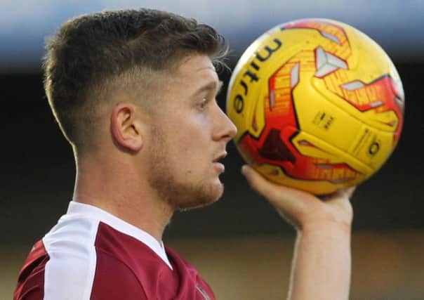 AIMING TO HAVE A BALL - Cobblers defender Aaron Phillips intends to make the most of his first team chance (Picture: Sharon Lucey)
