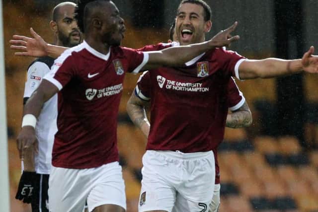 Gabriel Zakuani celebrates after heading the Cobblers into a first-half lead at Vale Park