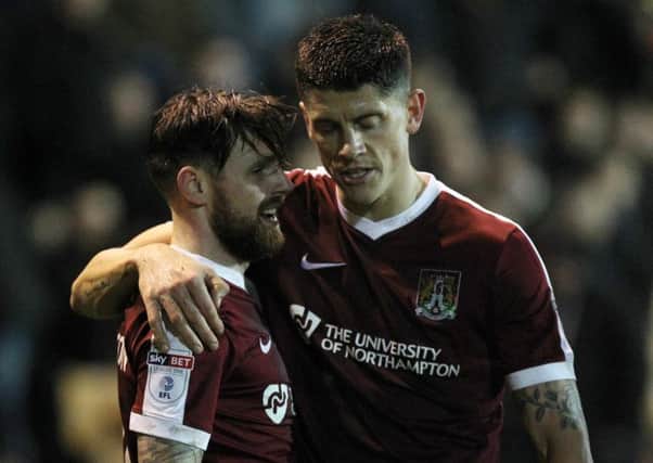TEAM-WORK - Alex Revell celebrates with Paul Anderson after the latter had prodded hom the Cobblers' third goal at Port Vale, pouncing to score after the goalkeeper had saved Revell's shot