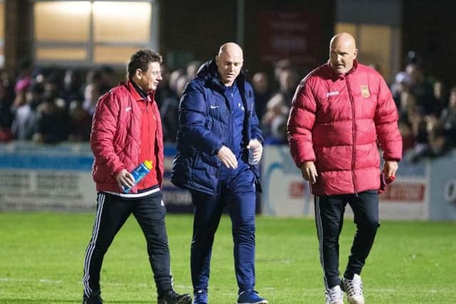 Rob Page chats to the Stourbridge management team ahead of kick-off