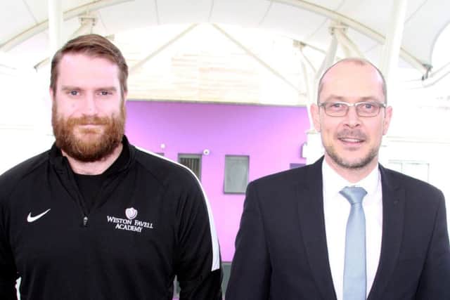 Quick-thinking PE teacher James Lucas and estates manager Richard Oliver put out a spreading fire at Weston Favell Academy.