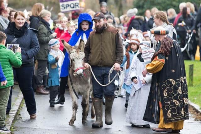 Primary school pupil rides real donkey through Northampton village streets while reenacting nativity