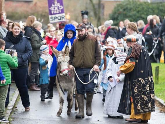 Primary school pupil rides real donkey through Northampton village streets while reenacting nativity