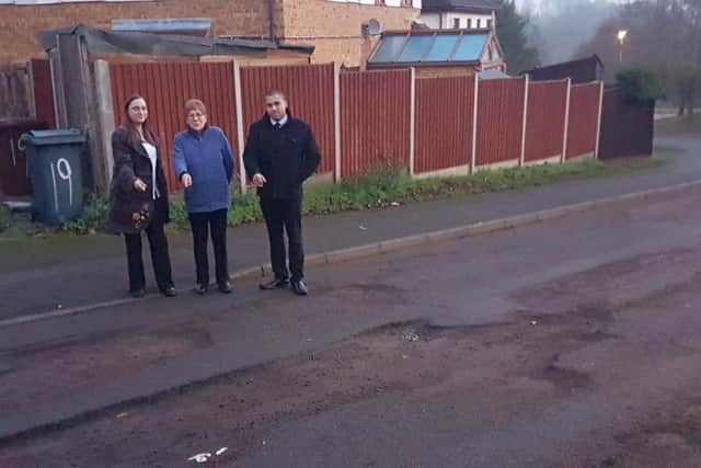 Councillor Hill with Rectory Farm residents on pothole-riddled Olden Road.