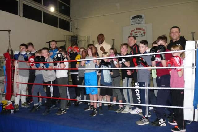 Frank poses for a snap with the young members of Far Cotton Boxing Club.