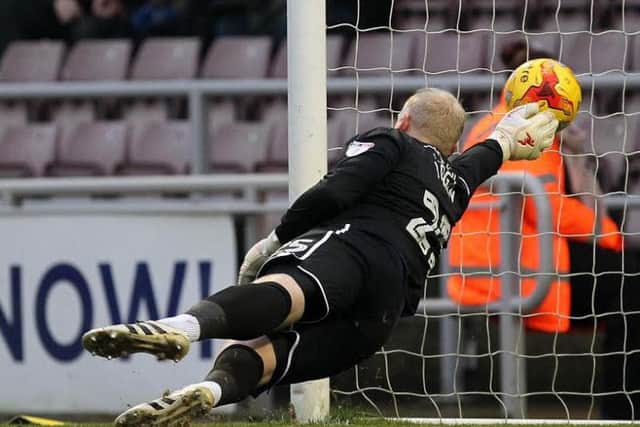 EARLY BOOST - Conrad Logan is powerless to stop Matt Taylor's free-kick flying into the net (Pictures: Sharon Lucey)