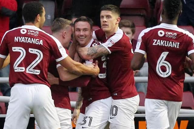 The Cobblers players celebrate Matt Taylor's opener