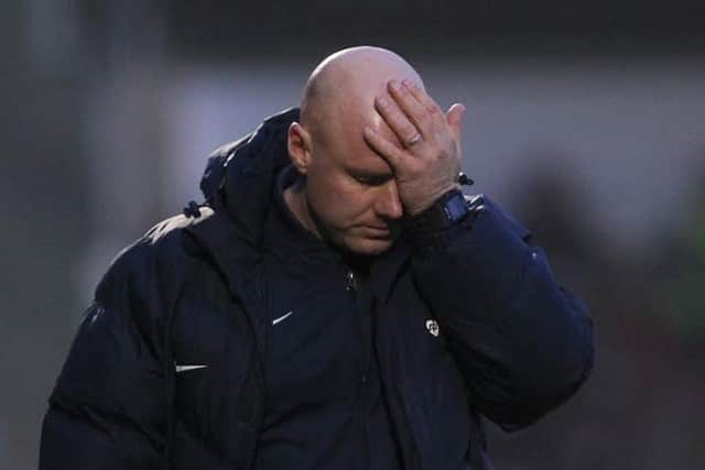 PAINFUL VIEWING - Rob Page watched his side slump to defeat against Rochdale at Sixfields (Picture: Sharon Lucey)
