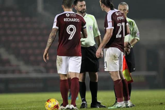 Marc Richards and John-Joe O'Toole chat to referee Eddie Ilderton at the end of the game