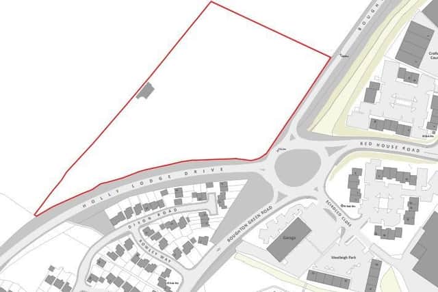 The homes would sit on the busy five-way roundabout joining Holly Lodge Drive and Boughton Green Road.