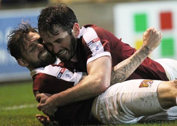WINNING FEELING - Paul Anderson and Jak McCourt celebrate after sealing the win at Port Vale on December 3, the only time the Cobblers have won in the past seven games