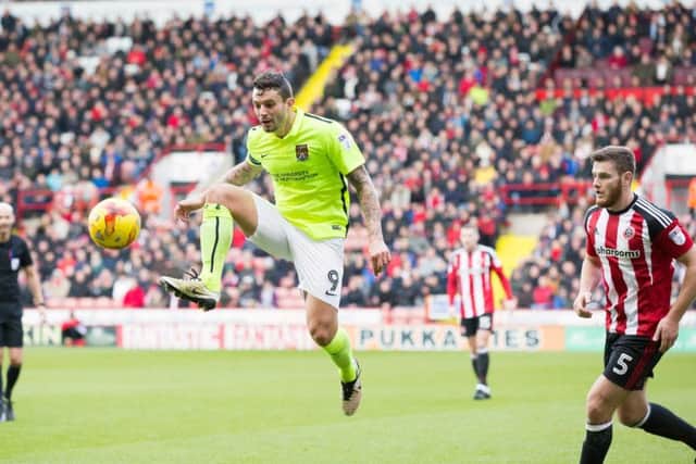Marc Richards lays off a pass during the Cobblers' defeat at Sheffield United