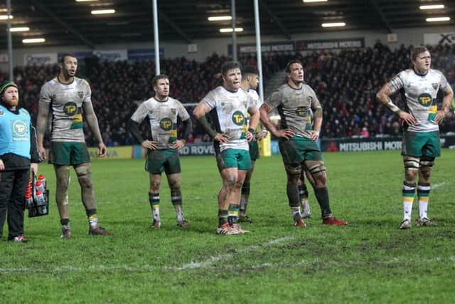 The Saints players watched the big screen as referee Matthew Carley discussed David Halaifonua's knock-on with the TMO