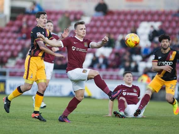 Sam Hoskins battles for possession during the Cobblers' defeat to Bradford City (Pictures: Kirsty Edmonds)