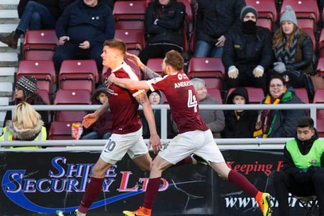Alex Revell and Paul Anderson celebrate the Cobblers' goal against Bradford