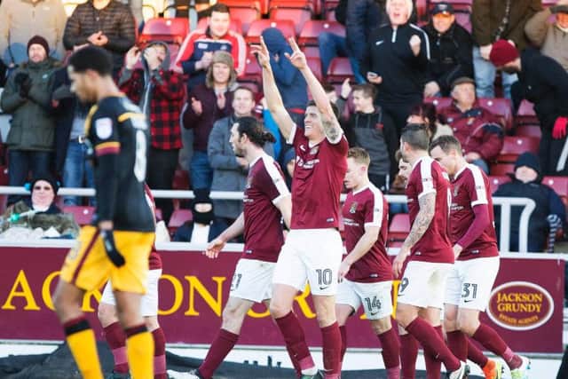 The Cobblers celebrate their goal against Bradford, but the team went on to lose 2-1