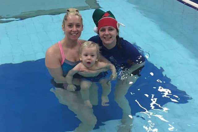 Katy Brown with her one-year-old son Jackson and Water Babies swimming teacher Emma Hardinges