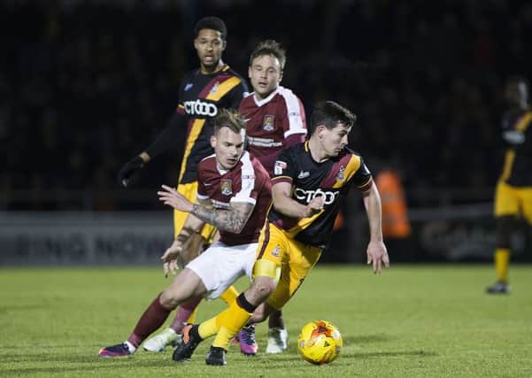 CHASING POSSESSION - the Cobblers were dominated by Bradford City on Monday