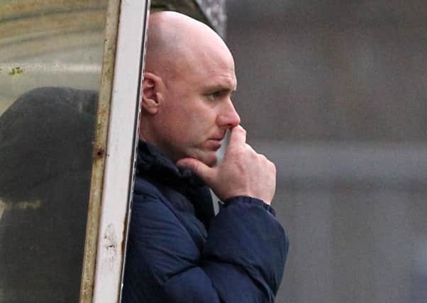 Rob Page watches on as the Cobblers are thrashed 5-0 at Bristol Rovers (Picture: Sharon Lucey)