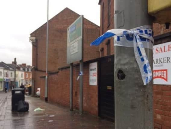 The remnants of a police cordon in Abington Street following an assault on Sunday morning..