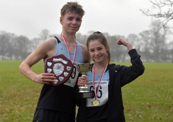 RUNNING IN THE FAMILY - Adam and Claudia Searle were both winners in the County Cross Country Championship at Abington Park on Saturday (Pictures: Dave Ikin)